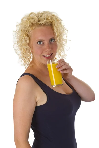 Young woman with glass orange juice — Stock Photo, Image