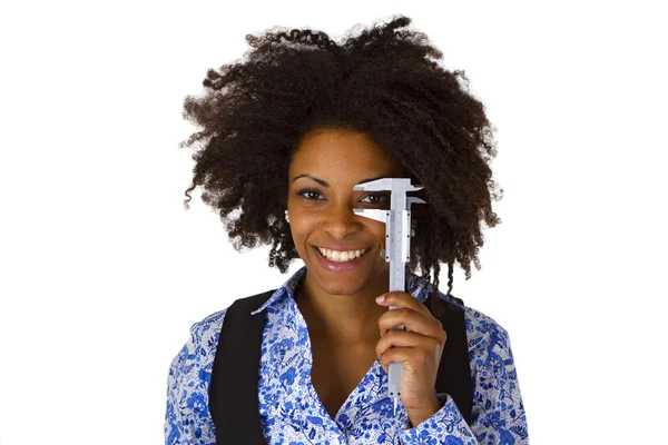 Attractive african woman holding caliper — Stock Photo, Image