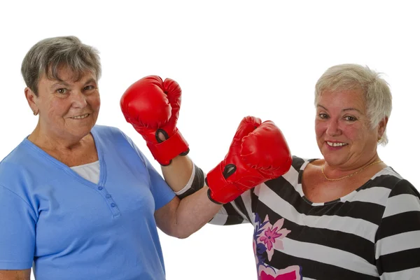 Two female seniors with red boxing glove — Stock Photo, Image