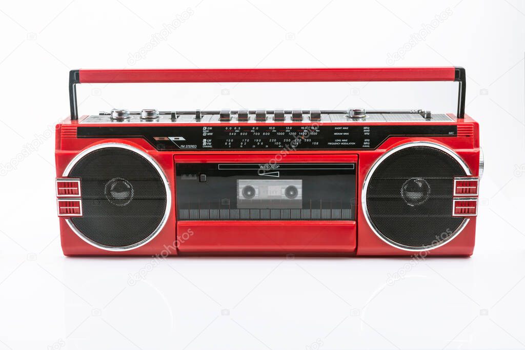Red vintage Tape player isolated on white background