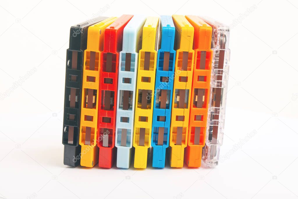 Collection of colorful audio tapes on white background