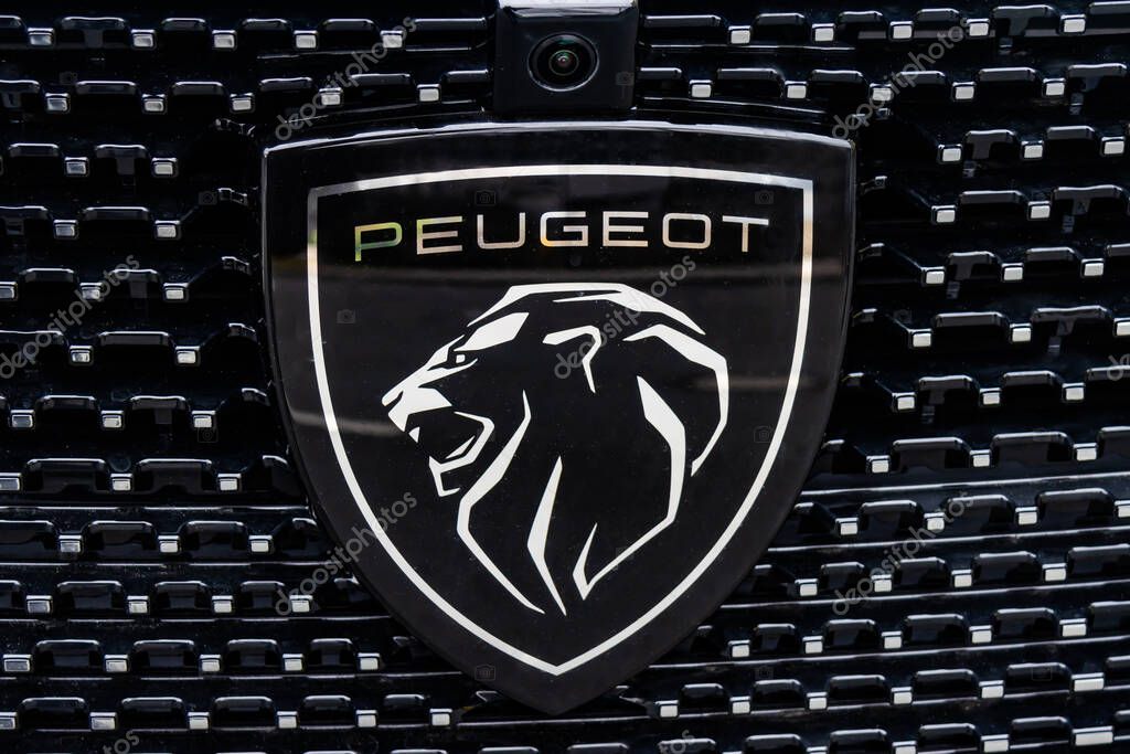 WETZLAR, GERMANY 2022-04-23: Peugeot logo closeup on a car grill. Peugeot as car manufacturer was founded at 1882.