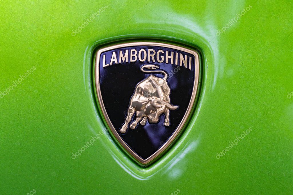 WETZLAR, GERMANY 2022-04-23: Lamborgini metallic logo closeup on Lamborghini car displayed.