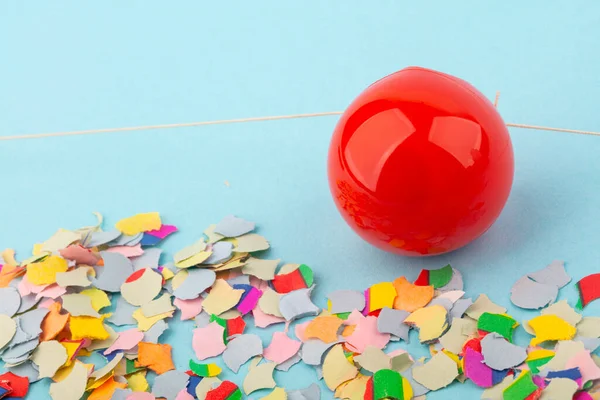 Red Nose Confetti Light Blue Background — Stock Photo, Image