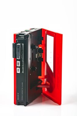 WETZLAR, GERMANY: 2022-04-16: Open red vintage SONY WALKMAN WM-24 over bright background.