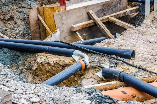 Civil engineering works with pipes in detail surround soil and gravel