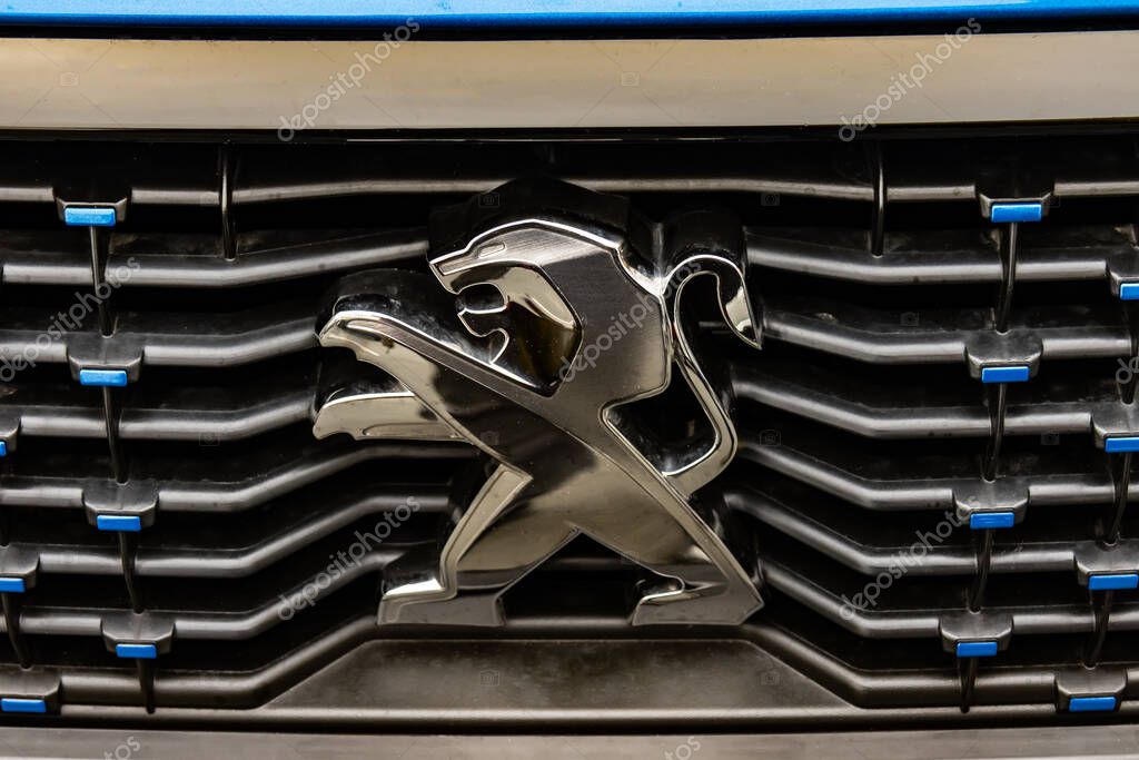 WETZLAR, GERMANY 2022-04-23: Peugeot logo closeup on a car grill. Peugeot as car manufacturer was founded at 1882.