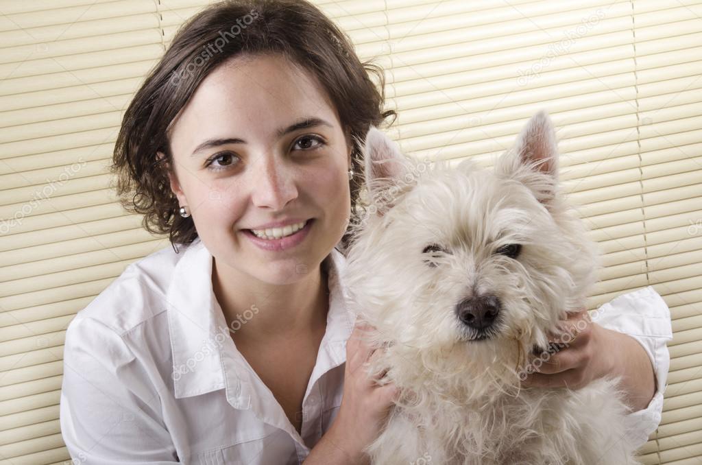 Young woman with her west highland terrier