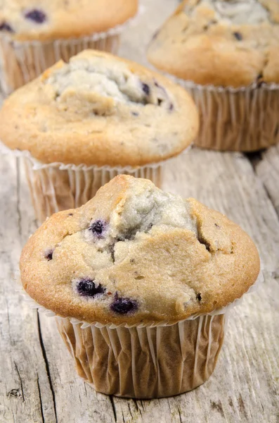 Home made blueberry muffins on a timber board — Stock Photo, Image