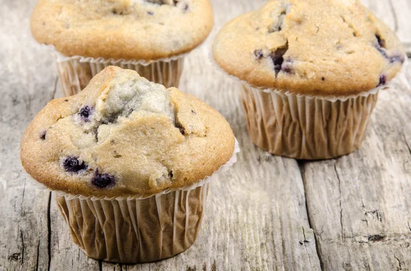 Home made cup cake on a timber board — Stock Photo, Image