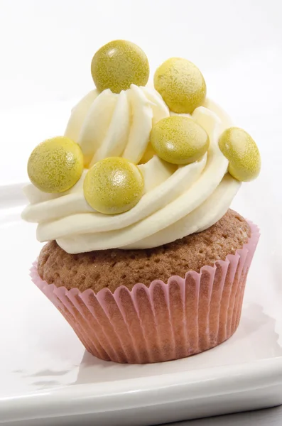 Cupcake with sugar coated chocolate — Stock Photo, Image