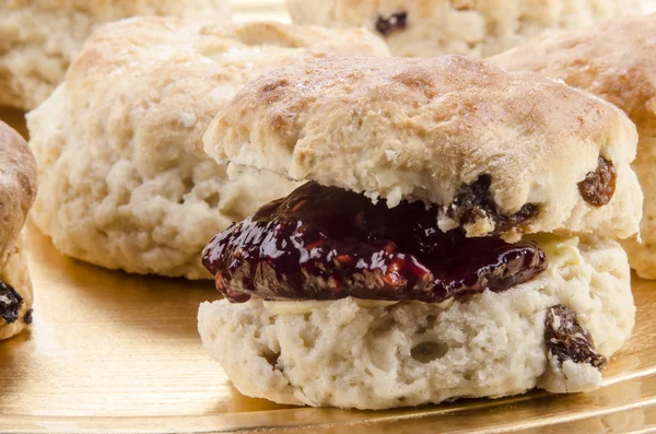 Scones with home made jam on a plate — Stock Photo, Image