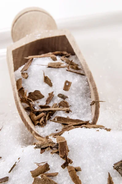 Sugar and crushed cinnamon on a wooden shovel — Stock Photo, Image