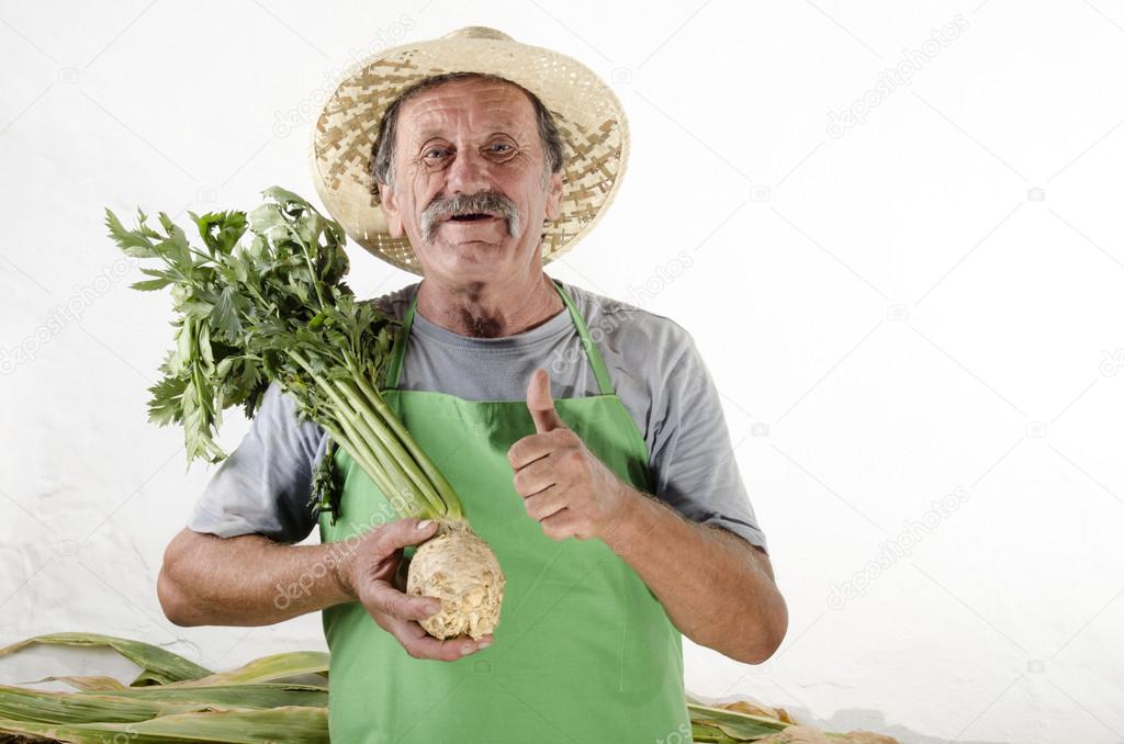Organic farmer with freshly harvested celery