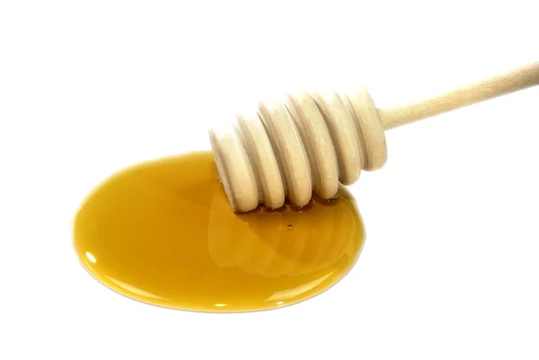 Honey and honeyspoon on a white background — Stock Photo, Image