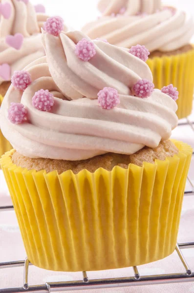 Cupcake with pink sugar balls — Stock Photo, Image