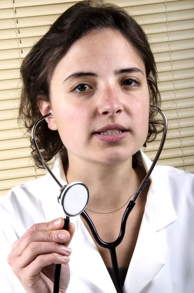 Medical staff member holding a stethoscope — Stock Photo, Image