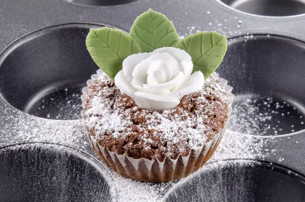 Chocolate cupcake with marzipan rose — Stock Photo, Image