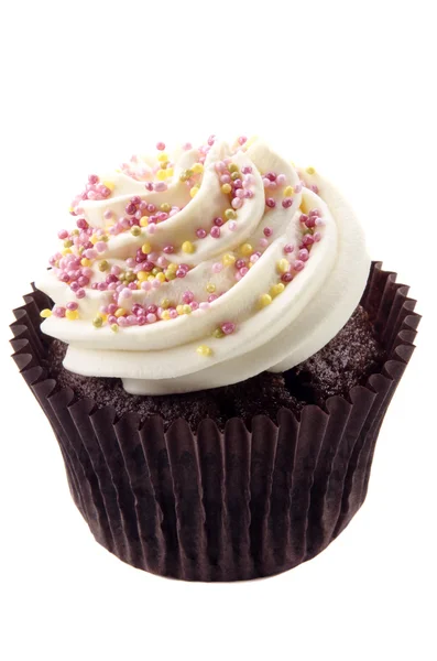 Cupcake with butter cream and colored sprinkles — Stock Photo, Image