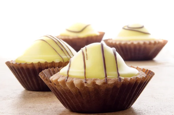 Cupcake with lemon icing — Stock Photo, Image
