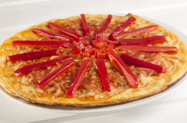 Pizza with red pepper stripes — Stock Photo, Image