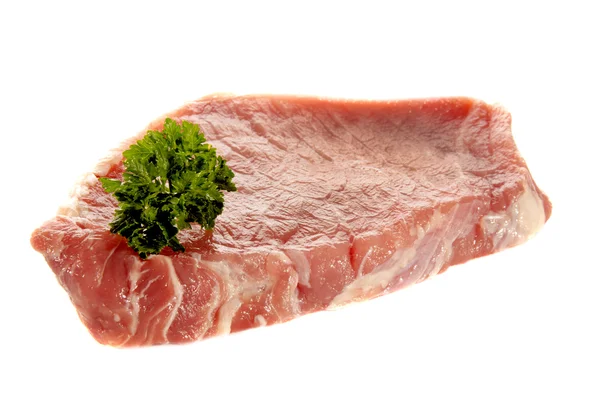 Raw pork chop with parsley — Stock Photo, Image