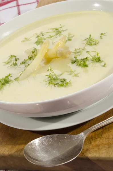 Asparagus cream soup in a white bowl — Stock Photo, Image