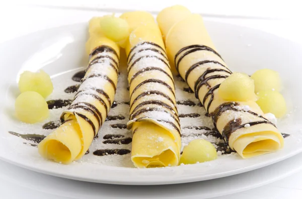 Pancake with chocolate sauce on a plate — Stock Photo, Image