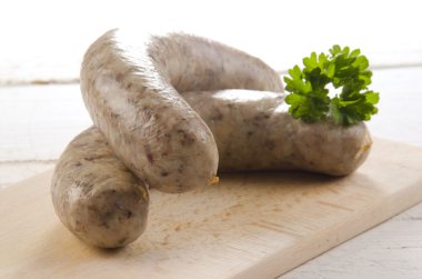 home made raw bratwurst with parsley clipart