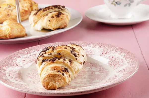 Chocolate croissant on a plate — Stock Photo, Image