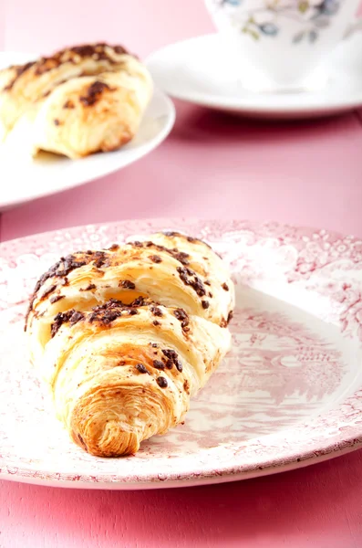 Chocolate croissant on a plate — Stock Photo, Image