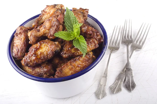 Chicken wings and mint — Stock Photo, Image