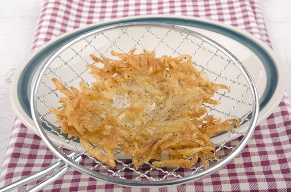 Hash brown is placed on a plate — Stock Photo, Image