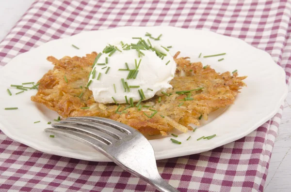 Hash brown with soft cheese — Stock Photo, Image