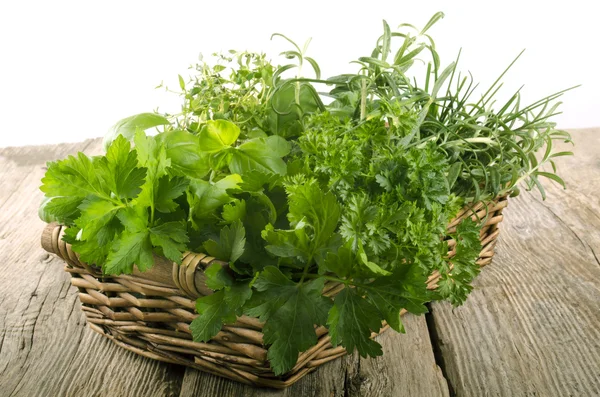 Garden herbs in a wicker basket — Stock Photo, Image