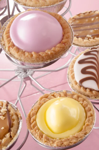 Cupcake with icing on a cupcake stand — Stock Photo, Image