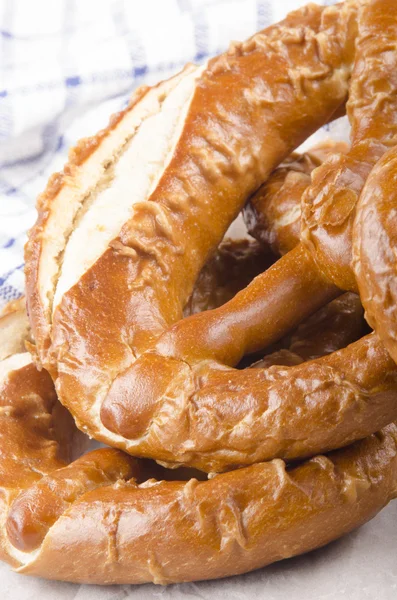 Home made bavarian prezel on baking paper — Stock Photo, Image