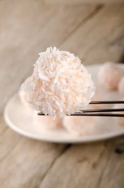 Strawberry champagne truffle on a praline fork — Stock Photo, Image