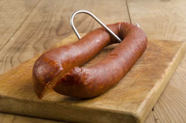 Hungarian kolbasz on a butchers hook — Stock Photo, Image