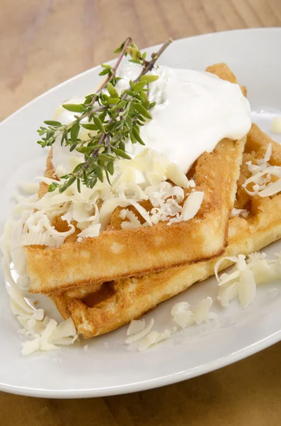 Waffle with sour cream and grated cheese — Stock Photo, Image