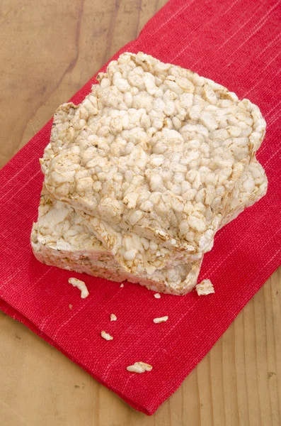 Puffed rice on a red cloth — Stock Photo, Image