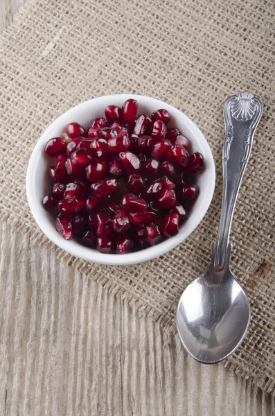 Pomegranate seed in a white bowl — Stock Photo, Image