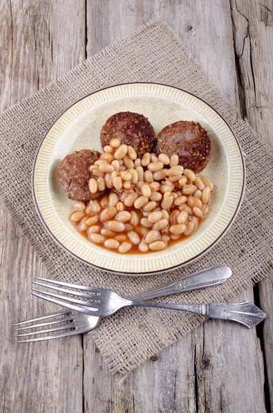 White pudding and baked beans — Stock Photo, Image