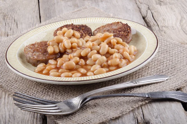 White pudding and baked beans — Stock Photo, Image