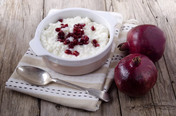 Rice pudding with pomegranate seed — Stock Photo, Image