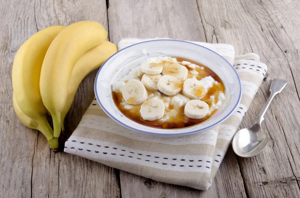 Rice pudding with banana slices — Stock Photo, Image