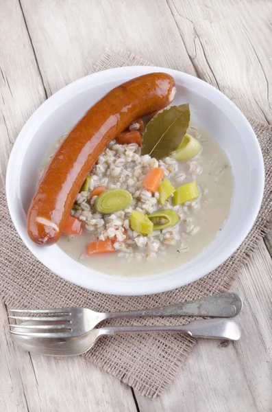 Pearl barley soup with smoked sausage — Stock Photo, Image