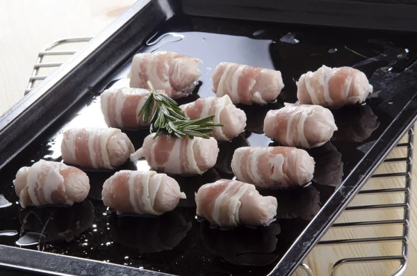 Pork sausage rolled in bacon — Stock Photo, Image