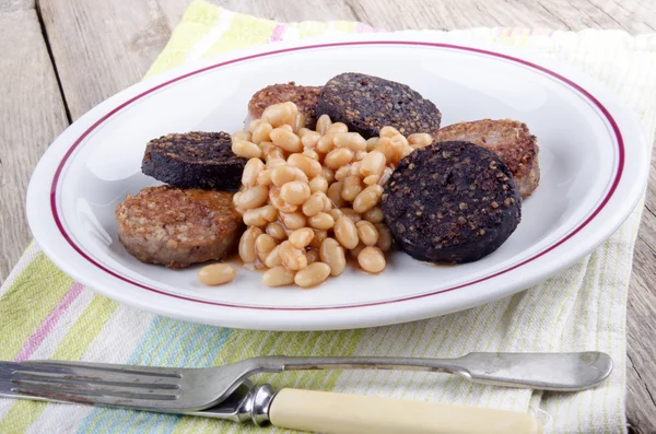 Black and white pudding with beans — Stock Photo, Image