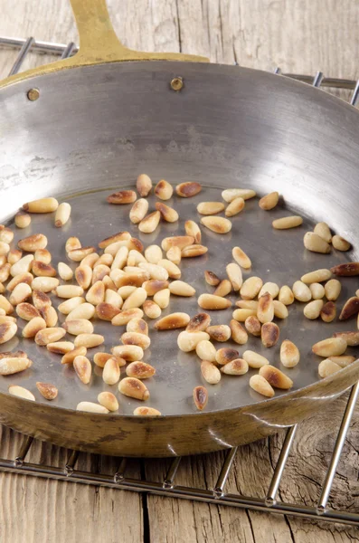 Roasted pin nut in a pan — Stock Photo, Image